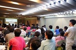 College students and professors listening keenly to the speech by Ares  representative.